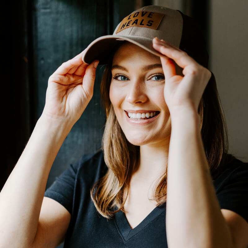 Love Heals Tan Trucker Hat