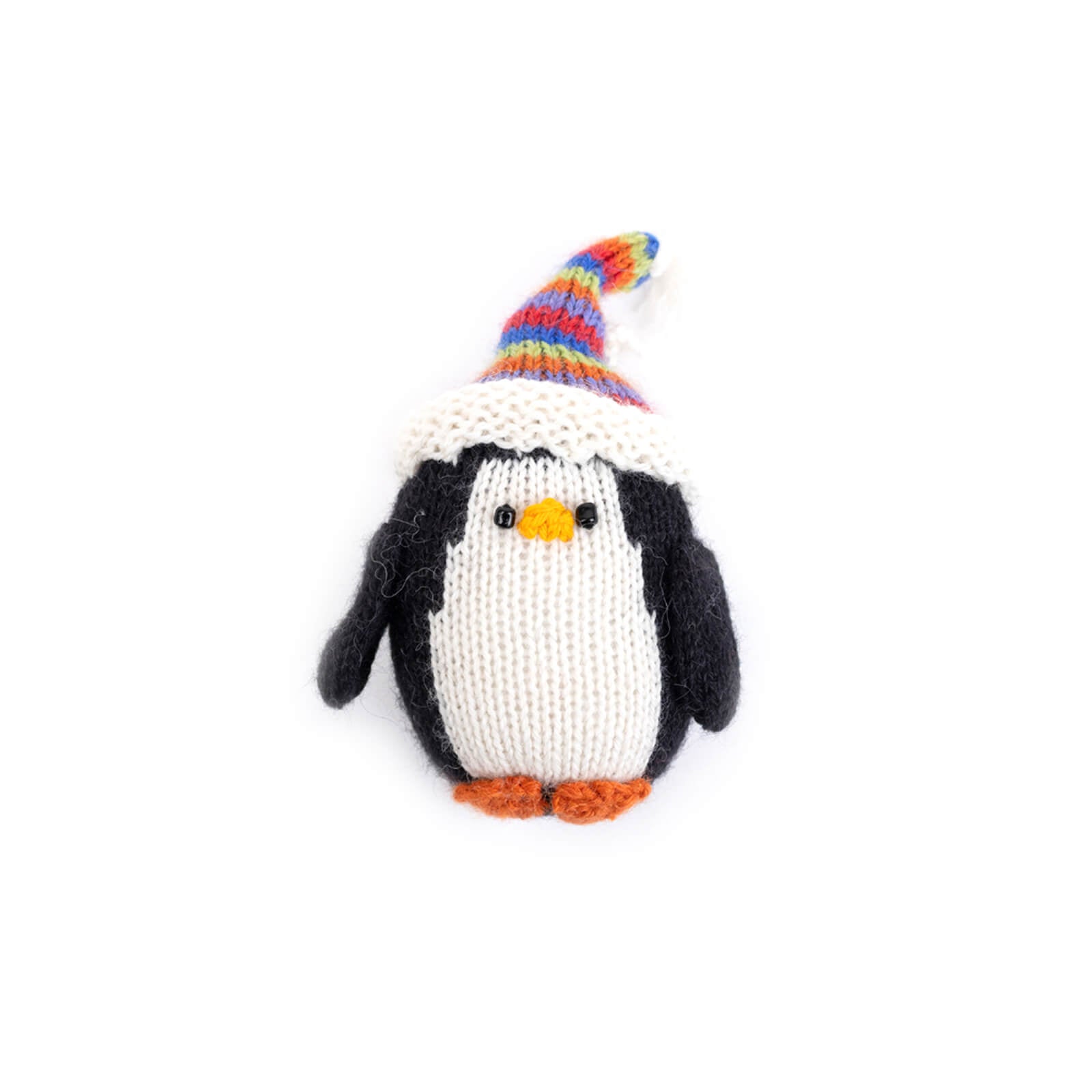 Knitted penguin toy with a colorful hat on a white background