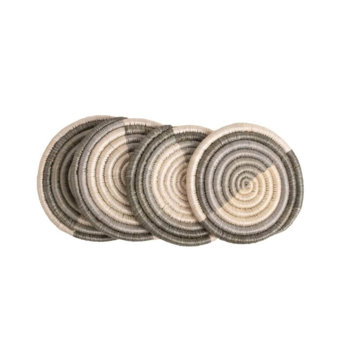 Set of four round woven coasters with concentric circle pattern on a white background