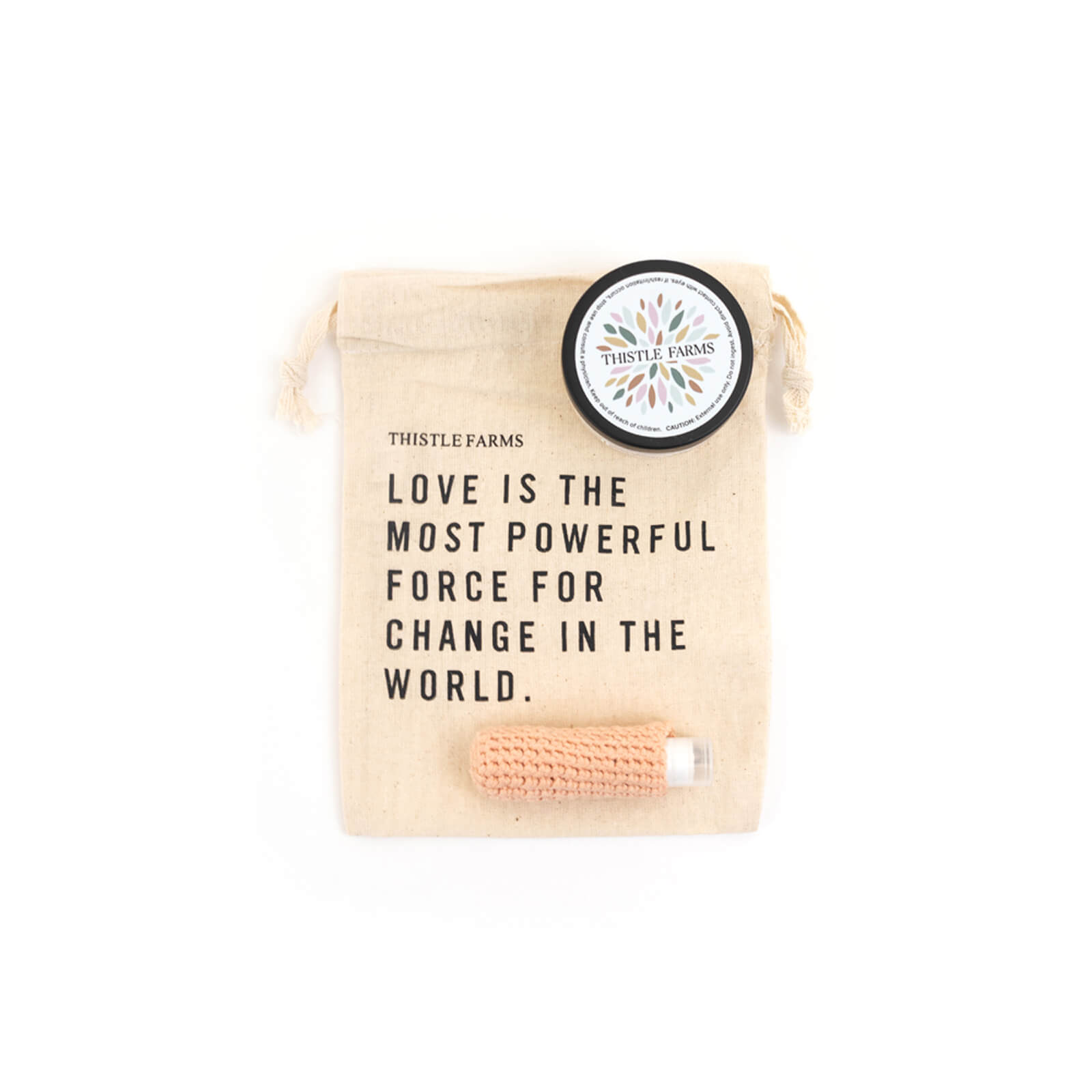 Product packaging with text and Thistle Farms logo on a white background
