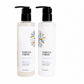 Two bottles of Thistle Farms hand soap and lotion on a white background