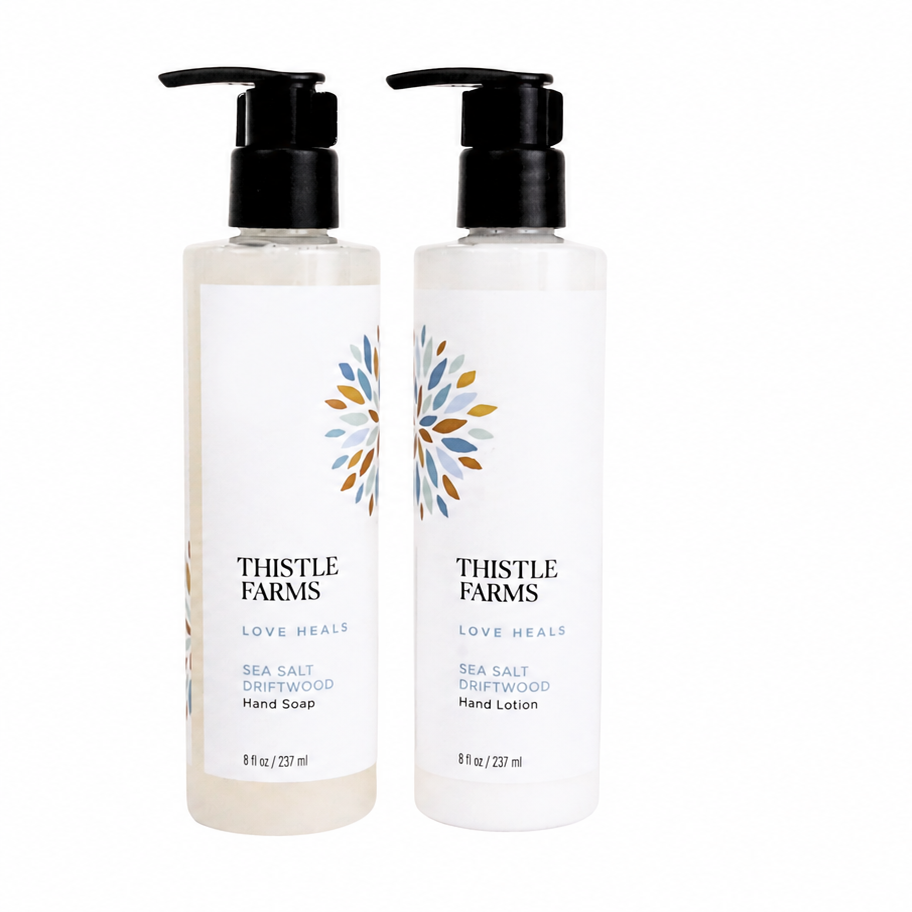 Two bottles of Thistle Farms hand soap and lotion on a white background