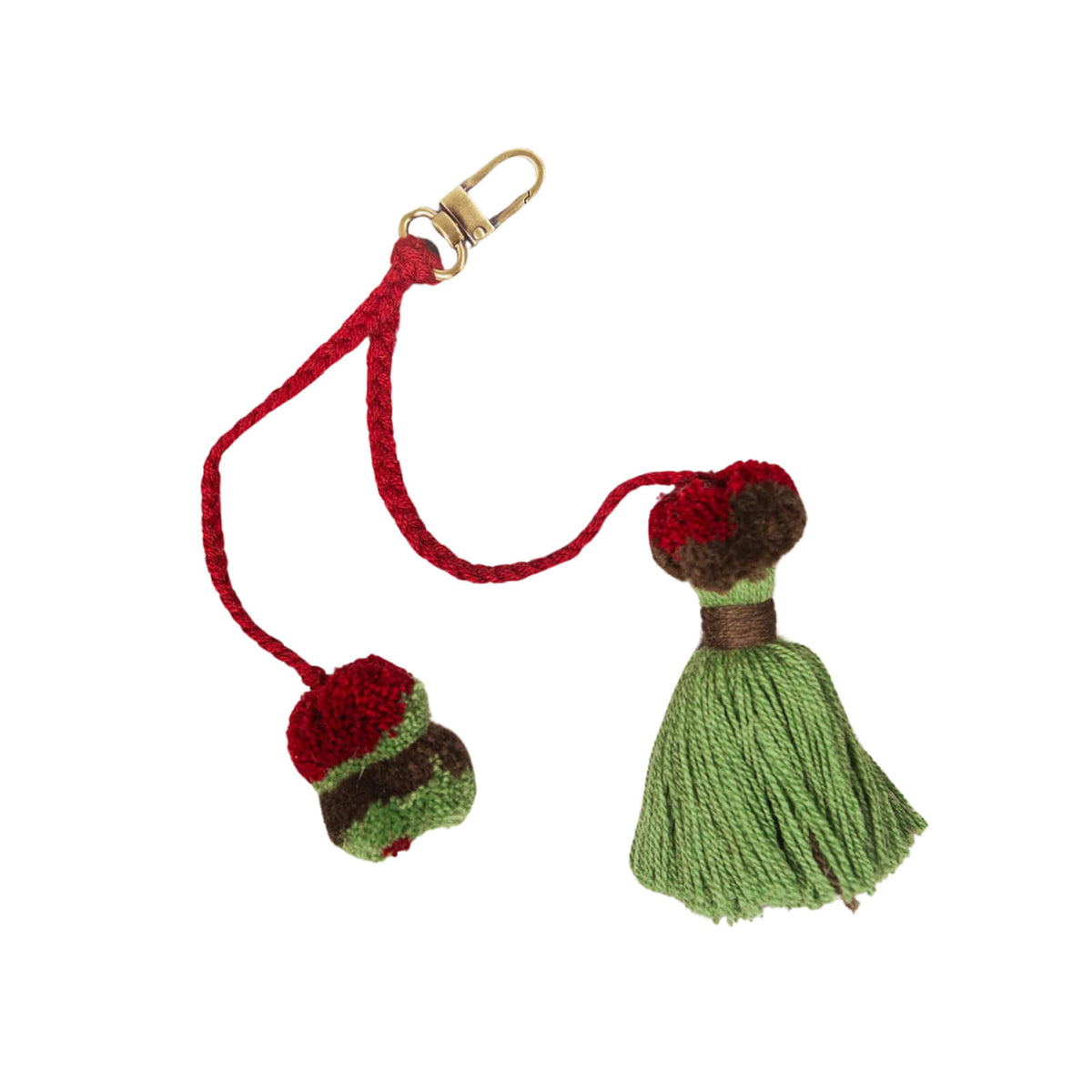 Red and green tassel keychain with a gold clasp on a white background
