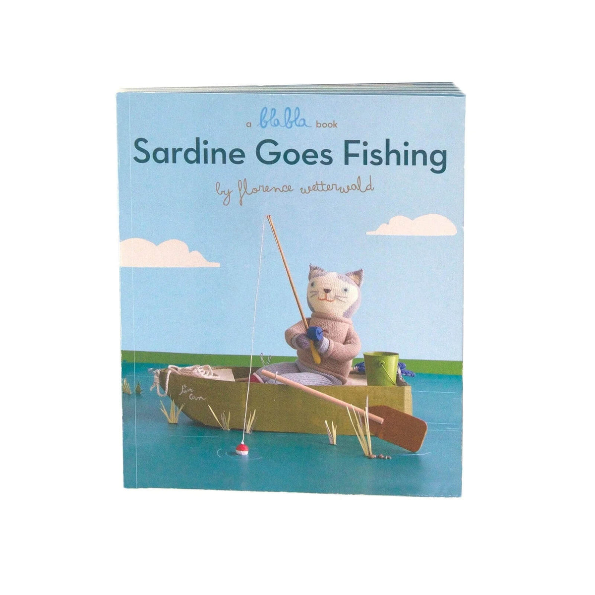 Book titled 'Sardine Goes Fishing' with a cat character in a boat on the cover.