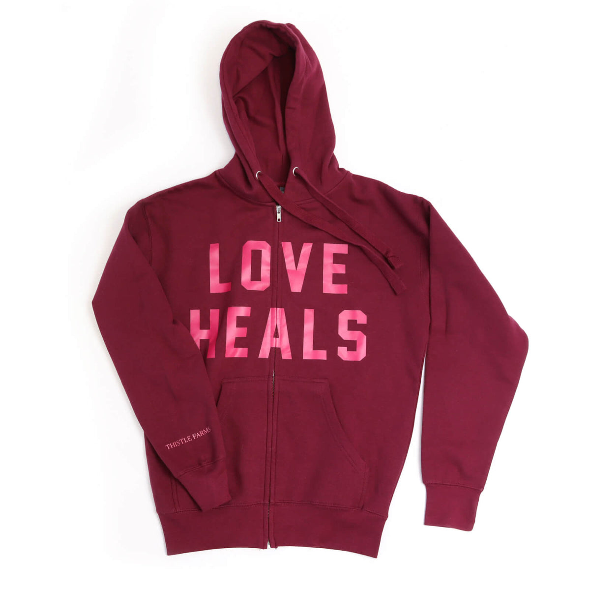 Maroon hoodie with 'LOVE HEALS' text in pink on a white background