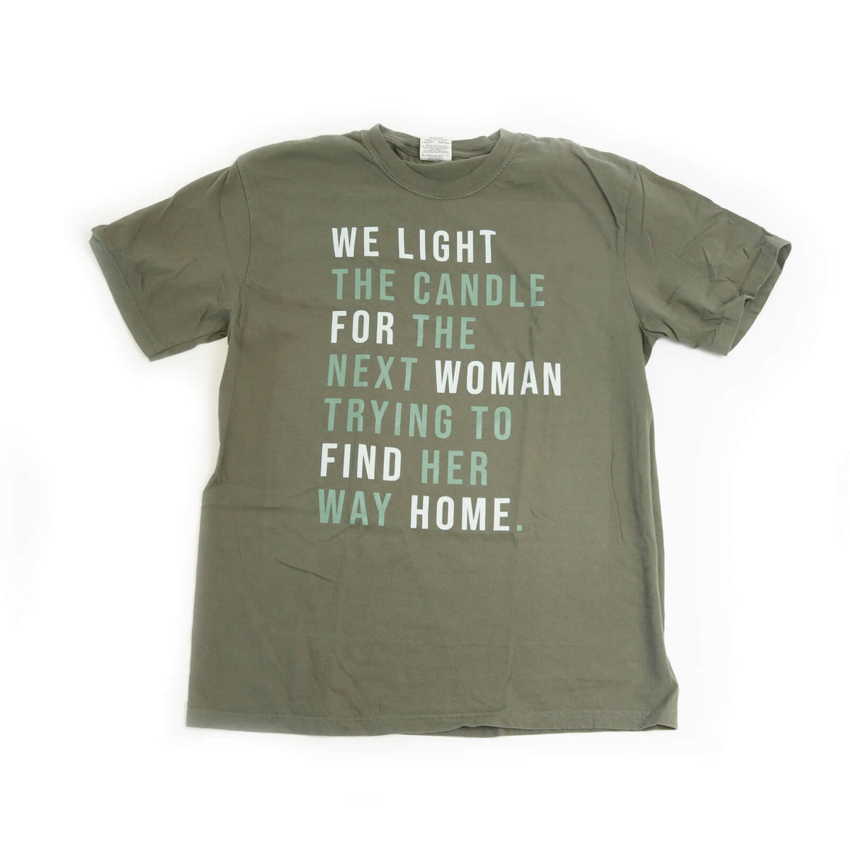 Green t-shirt with motivational quote on a white background