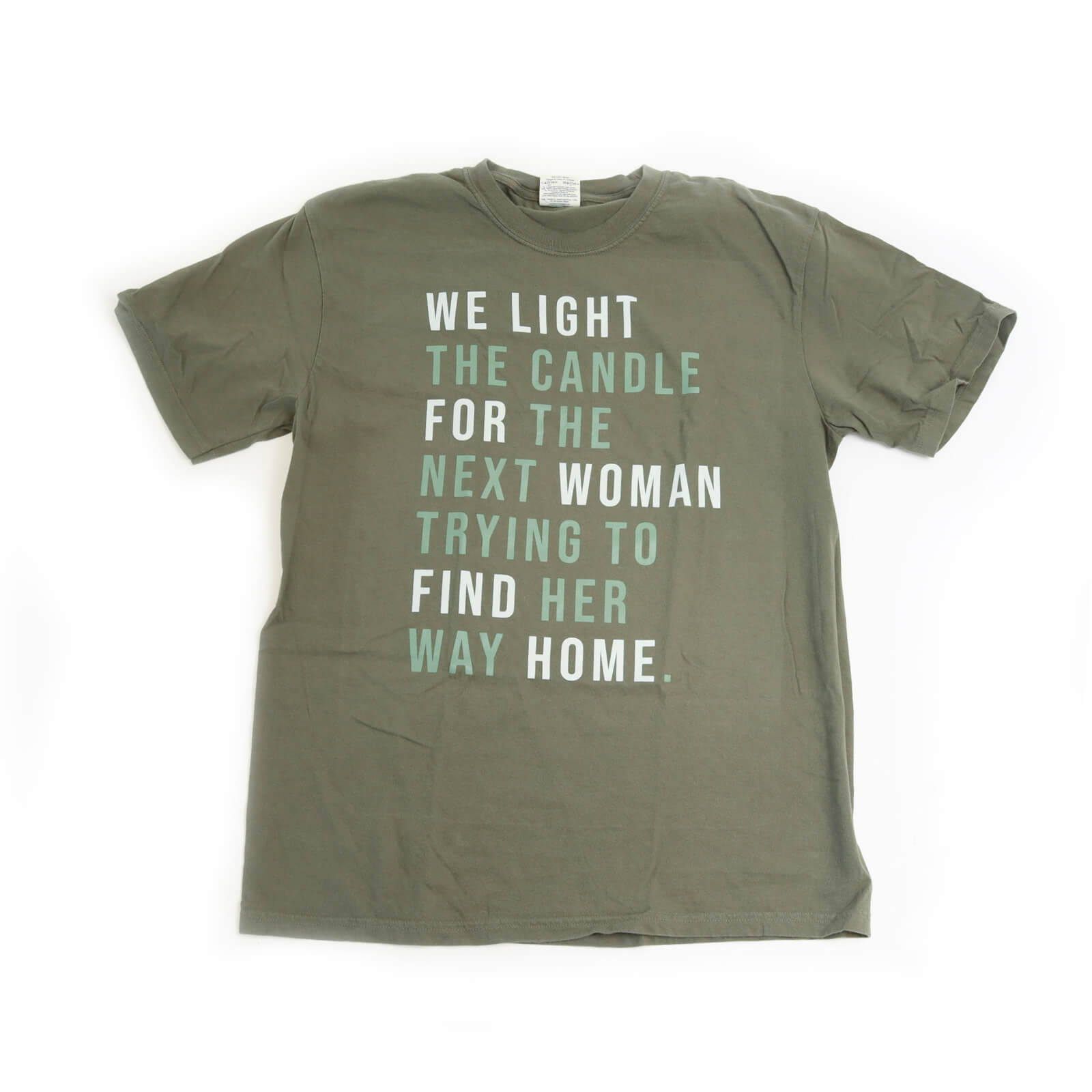 Green t-shirt with motivational quote on a white background