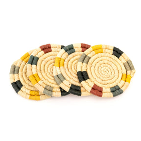 Set of woven coasters with multicolor pattern on a white background