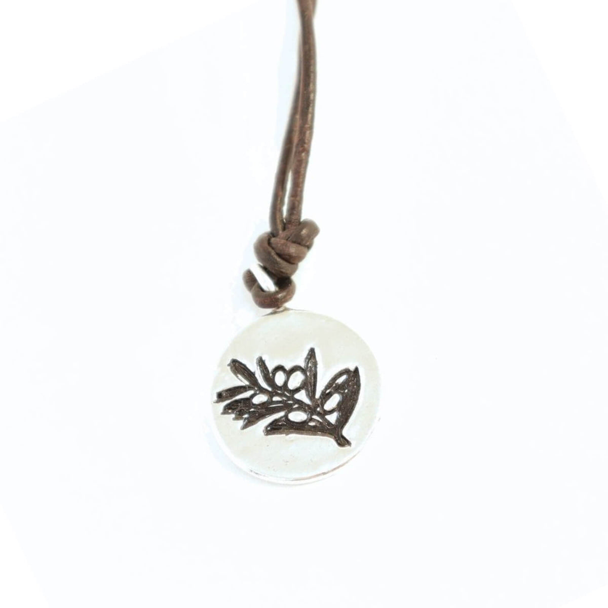 Necklace with a round pendant featuring a olive branch design on a white background