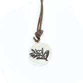 Necklace with a round pendant featuring a olive branch design on a white background