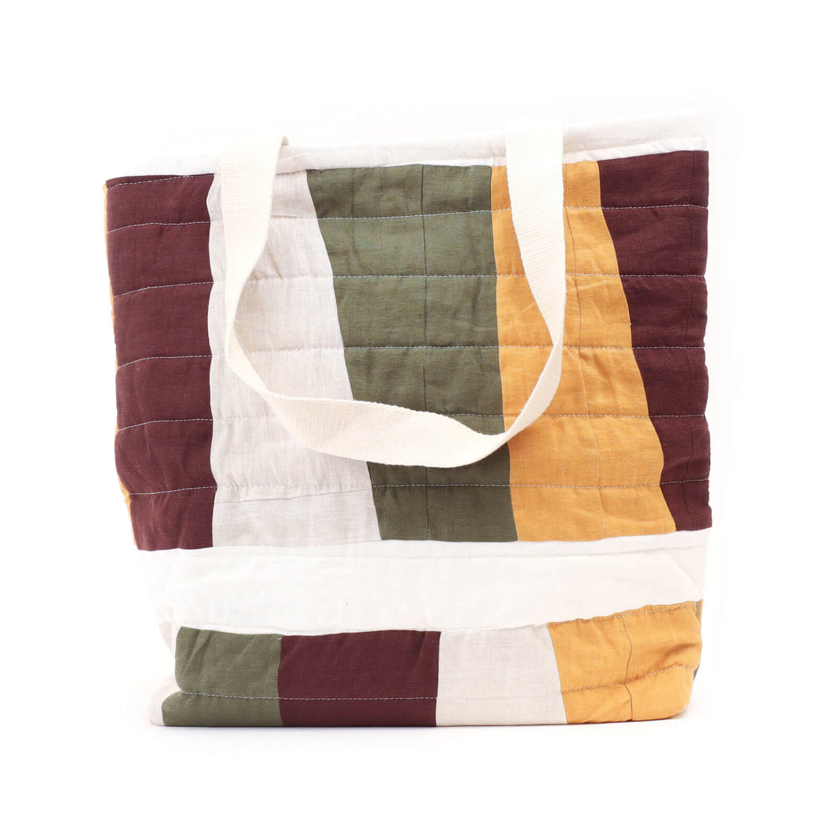 Colorful quilted tote bag with geometric pattern on a white background