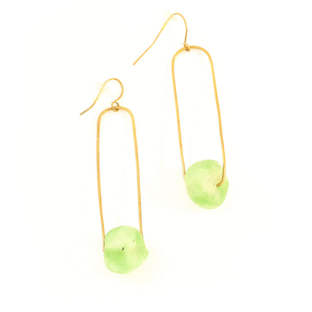 Gold earrings with green beads on a white background