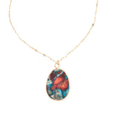 Necklace with a multicolored pendant on a white background