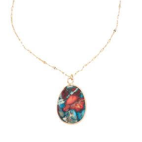 Necklace with a multicolored pendant on a white background