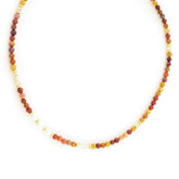 Necklace with multicolored beads on a white background