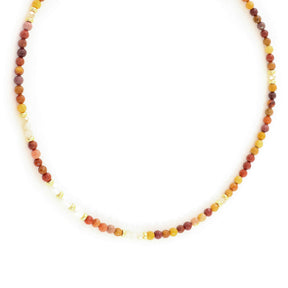 Necklace with multicolored beads on a white background