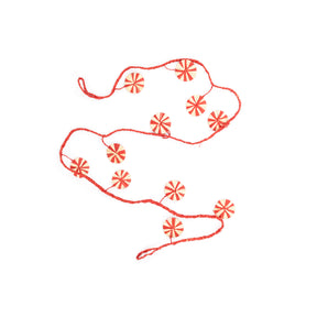 Decorative red floral pattern on a white background