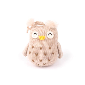 Knitted owl toy with a yellow beack on a white background