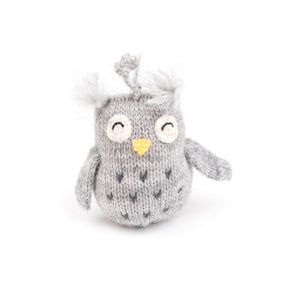 Gray knitted owl toy with white accents on a white background
