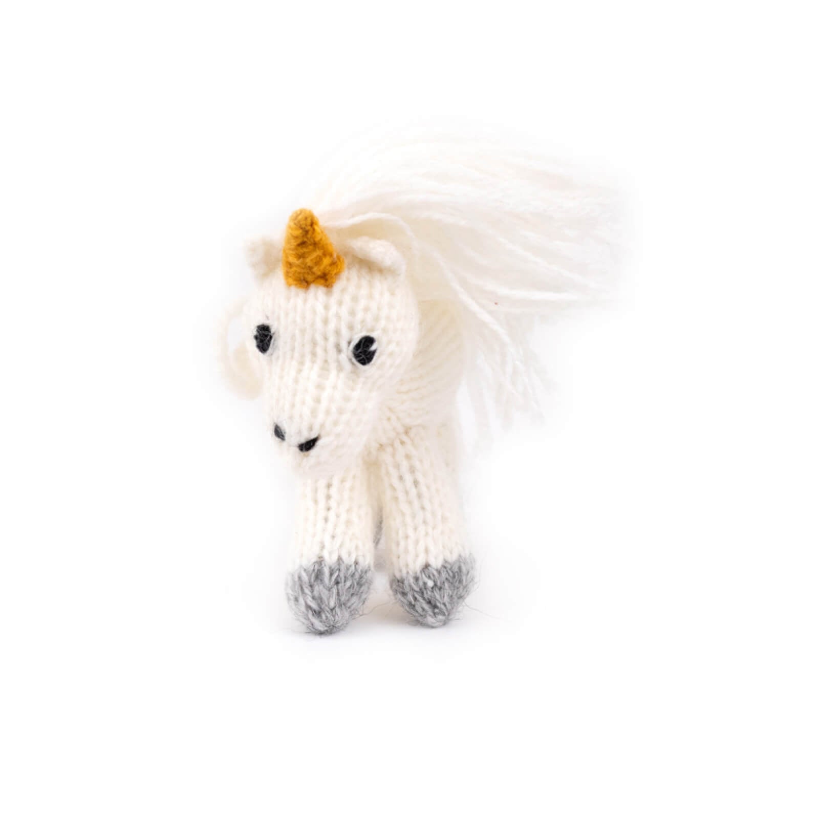 Knitted unicorn toy on a white background