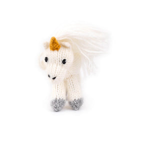 Knitted unicorn toy on a white background