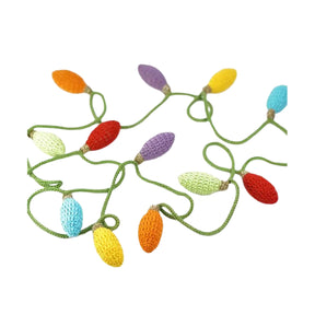 Colorful crocheted Christmas lights on a white background