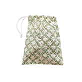 Drawstring bag with green geometric pattern on a white background