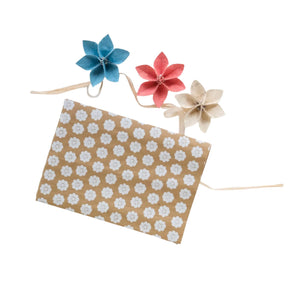 Floral-patterned paper with decorative flowers on a white background