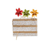Gift bag with decorative flowers on a white background