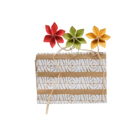 Gift bag with decorative flowers on a white background
