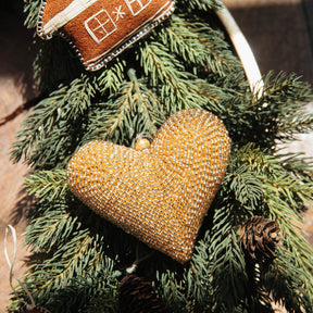Gold heart-shaped ornament on a Christmas tree