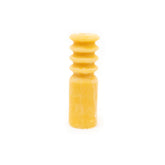 Yellow wax candle on a white background