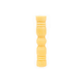 Yellow wax candle on a white background