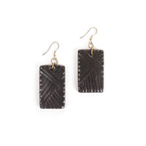 Pair of black rectangular earrings with gold hooks on a white background