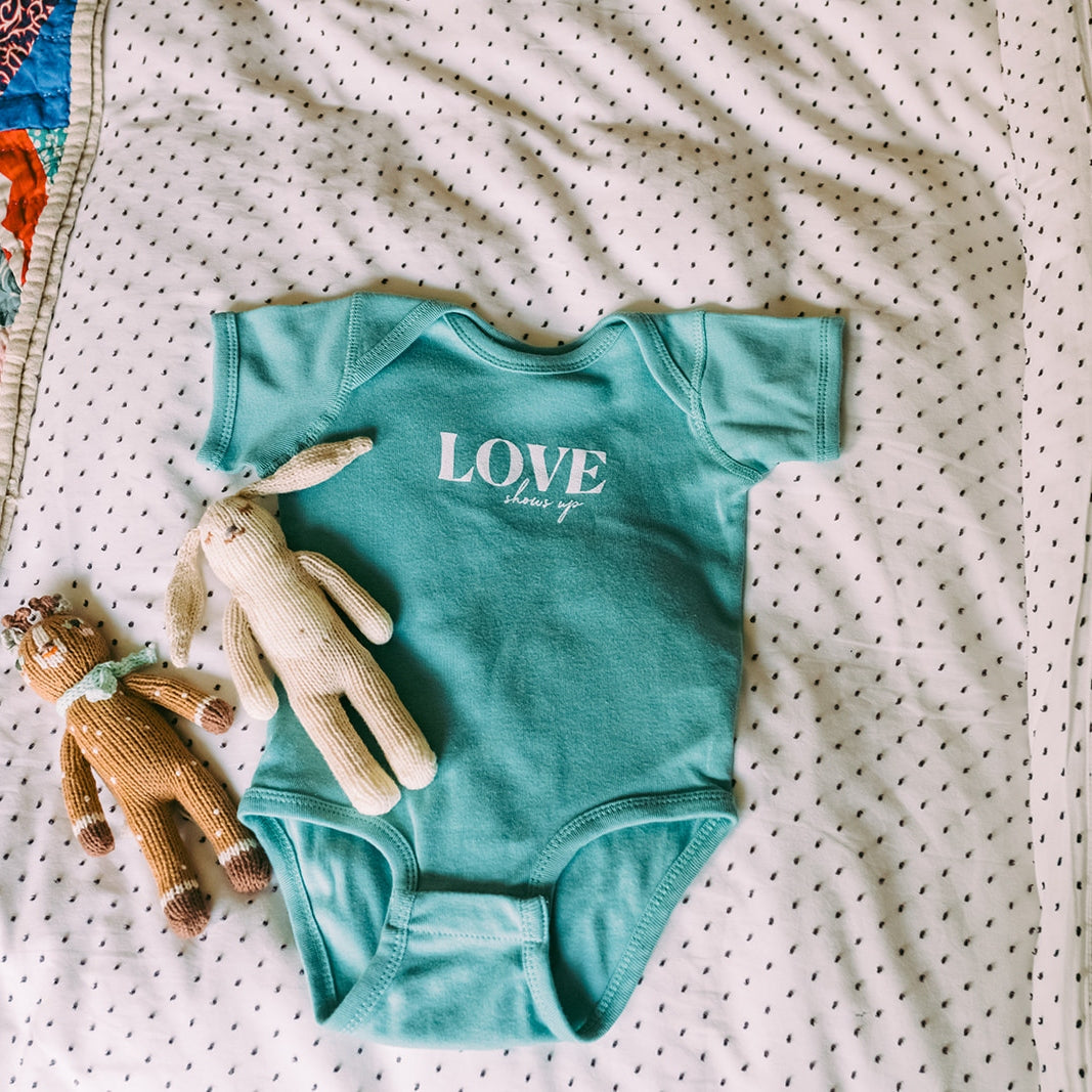 Love Shows Up Onesie