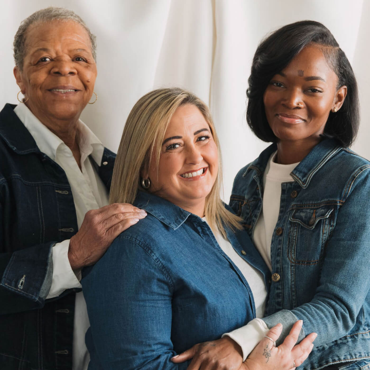 women survivors hugging and smiling