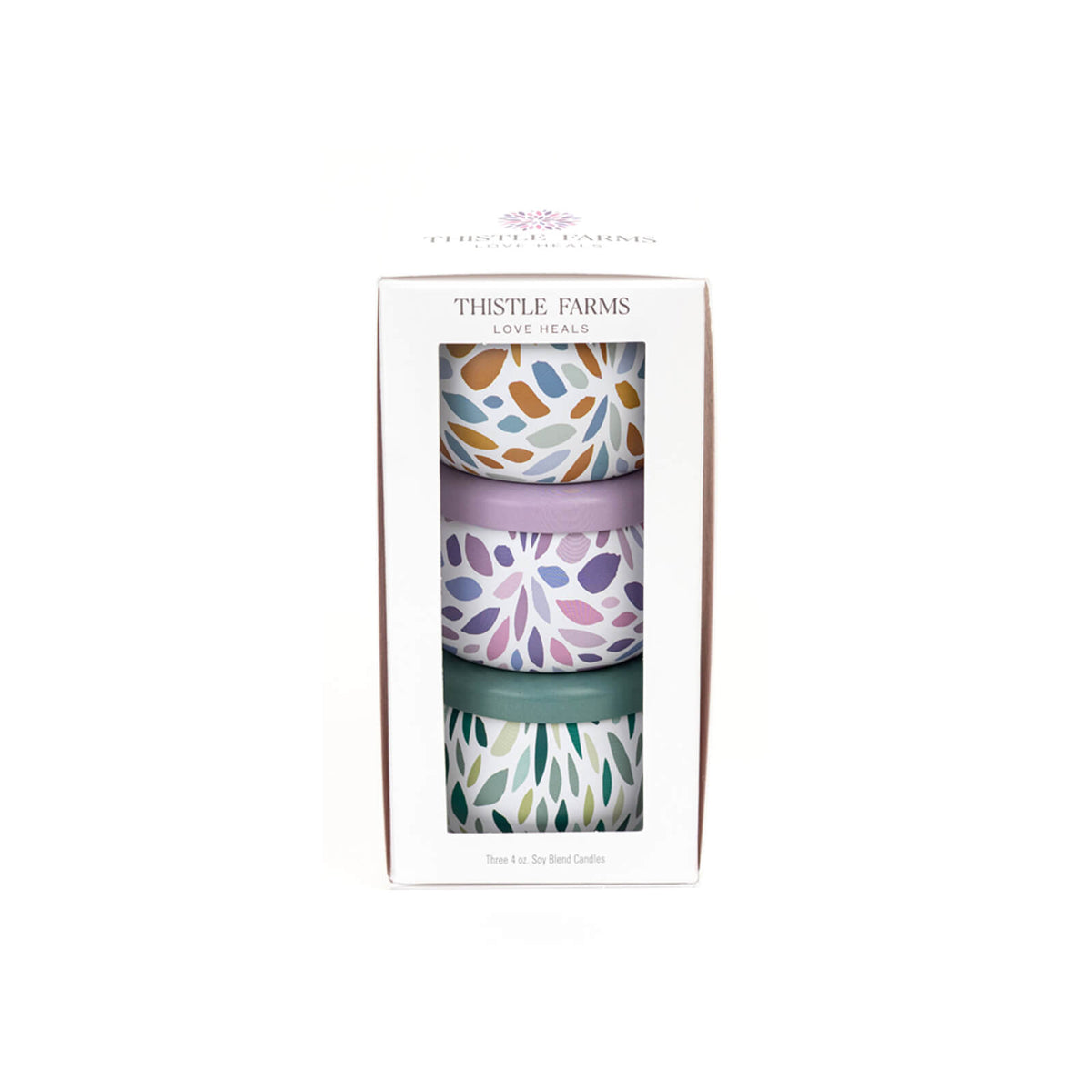 Three patterned cups in a box with 'Thistle Farms' branding on a white background