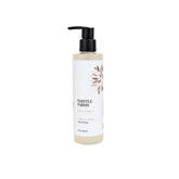 A bottle of Thistle Farms Love Heals Hand Soak in Vanilla Bean scent, featuring a white label with a brown floral design and a black pump dispenser, set against a plain white background.