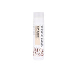 A single tube of Thistle Farms Lip Balm in Vanilla Bean scent, shown against a plain white background. The tube is white with black text and a small brown leaf pattern near the bottom.